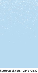 Snowy christmas background. Subtle flying snow flakes and stars on light blue winter backdrop. Delicate sweet snowy christmas. Vertical vector illustration.