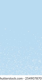 Snowy christmas background. Subtle flying snow flakes and stars on light blue winter backdrop. Delicate sweet snowy christmas. Vertical vector illustration.