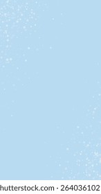 Snowy christmas background. Subtle flying snow flakes and stars on light blue winter backdrop. Delicate sweet snowy christmas. Vertical vector illustration.