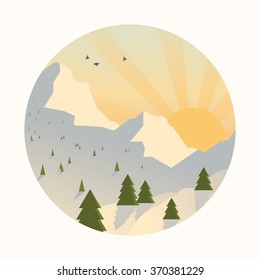 Snowy mountain range with rising sun.