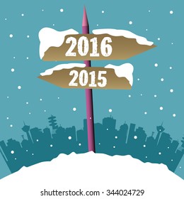 Snowy signpost with two brown arrows indicating two different directions and the years 2016 and 2015 written on each arrow. Passing into the new year concept
