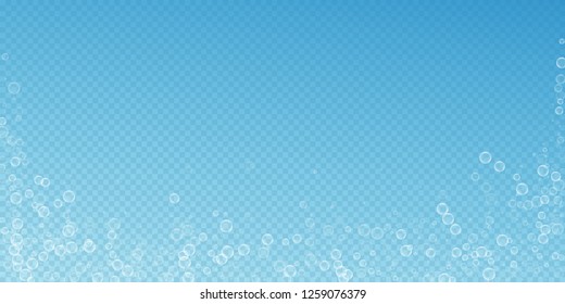 Soap bubbles abstract background. Blowing bubbles on transparent blue background. Artistic soapy foam overlay template. 