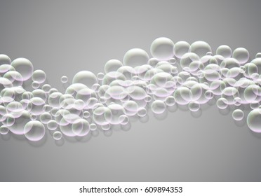 Soap bubbles background with rainbow colored airy foam