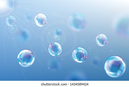 Soap bubbles blue background, realistic transparent air spheres of rainbow colors with reflections and highlights floating through air in rays of sunlight. Beautiful design element