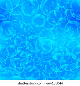 A lot of soap bubbles and foam in blue water seamless pattern