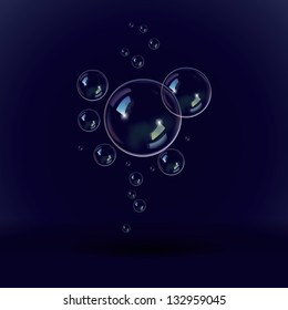 Soap bubbles on a black blue background