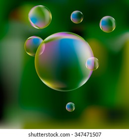 Soap bubbles on green background