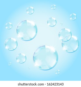 soap bubbles on light blue background