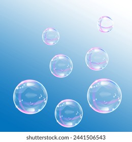 Soap bubbles set in rainbow colors on a blue and white background 