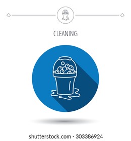 Soapy cleaning icon. Bucket with foam and bubbles sign. Blue flat circle button. Linear icon with shadow. Vector