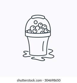 Soapy cleaning icon. Bucket with foam and bubbles sign. Linear outline icon on white background. Vector