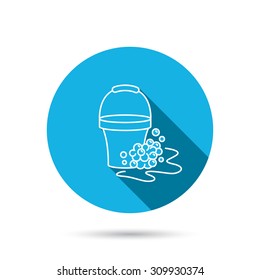 Soapy cleaning icon. Bucket with foam and bubbles sign. Blue flat circle button with shadow. Vector