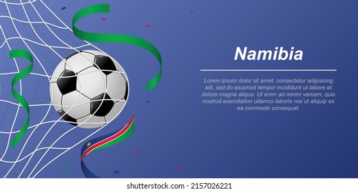 Soccer background with flying ribbons in colors of the flag of Namibia. Realistic soccer ball in goal net.