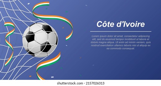 Soccer background with flying ribbons in colors of the flag of Ivory Coast. Realistic soccer ball in goal net.