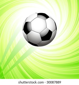 soccer ball bursting into centre of swirling green background