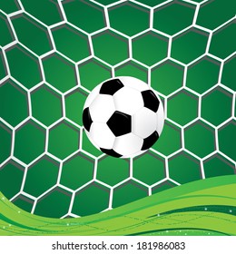 Soccer ball in goal in net