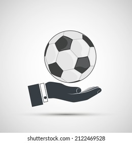 Soccer ball in the hand of the coach or referee. Vector icon. Logo isolated on a white background.