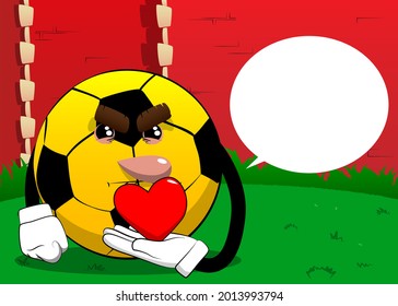 Soccer ball holding red heart in his hand. Traditional football ball as a cartoon character with face.