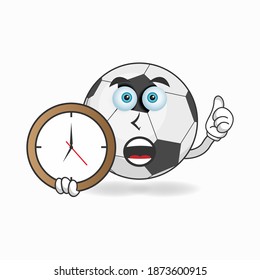 Soccer Ball mascot character holding a wall clock. vector illustration