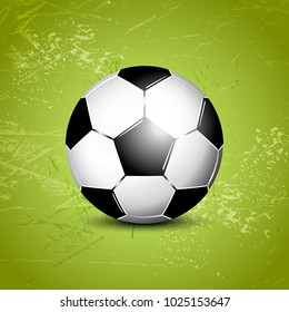 Soccer ball on abstract green grass field background - football template