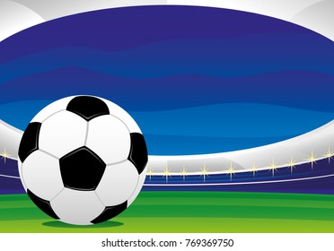 Soccer ball on the grass in the background of the stadium.