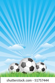 soccer ball on grass with blue sky