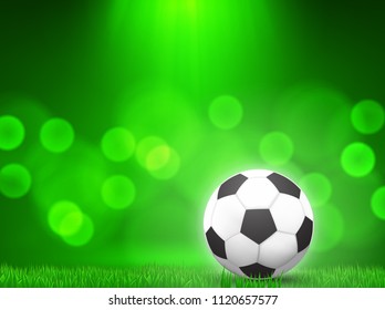 soccer ball on grass with  green bokeh  background