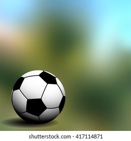 soccer ball on the green blurred background