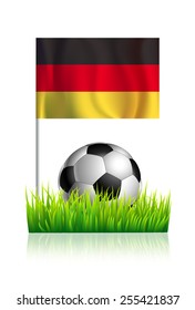 Soccer Ball on green grass field with flag of Germany