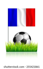 Soccer Ball on green grass field with flag of France.