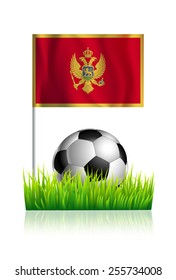 Soccer Ball on green grass field with flag of Montenegro