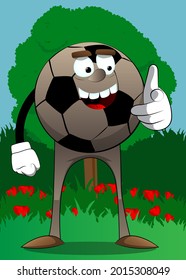 Soccer ball pointing at the viewer with his hand. Traditional football ball as a cartoon character with face.