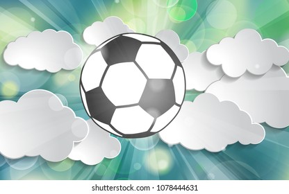 soccer ball in the rays of light of victory in the clouds