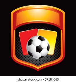 soccer ball with red and yellow cards on orange display