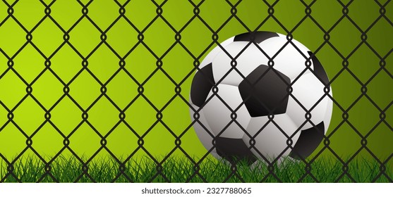 Soccer ball and steel wire chain. Chainlink fence or chain link fence. Soccer ball or football net. Green football grass field. Mesh, wired fence wk, ek sport supporters 2022, 2023, 2024