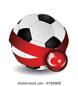 Soccer ball wrapped in medal strap and badge with flag of Turkey