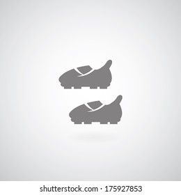 Soccer boots on gray background 