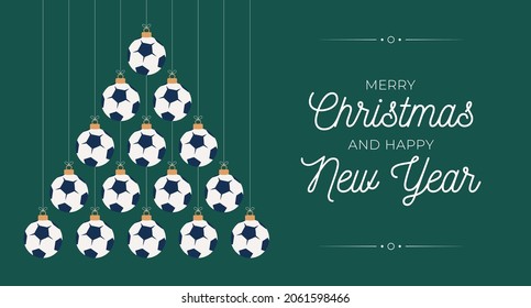 soccer Christmas and new year greeting card bauble tree. Creative Xmas tree made by football ball on black background for Christmas and New Year celebration. Sport greeting card