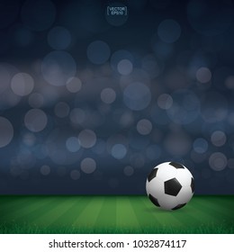 Soccer football ball in green grass of soccer field or football field stadium background. Vector illustration.
