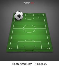 Soccer football ball on soccer field or football field with gray background. Perspective elements. Vector green court for create game.