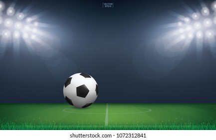 Soccer football ball on green grass of soccer field or football field stadium background. Vector illustration.
