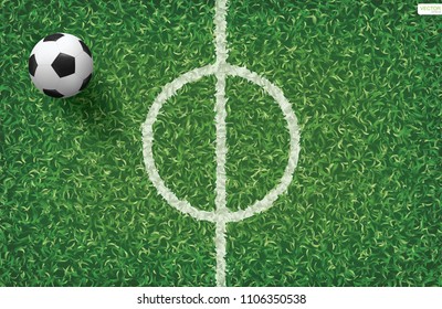 Soccer football ball on green grass of soccer field background. Vector illustration.
