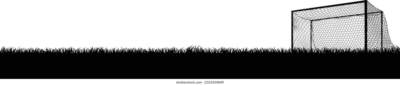 A soccer football pitch field and goal in silhouette