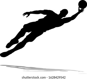 A soccer or football player in silhouette 