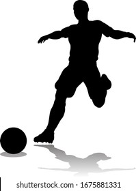 A soccer or football player in silhouette 