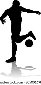 A soccer or football player in silhouette 