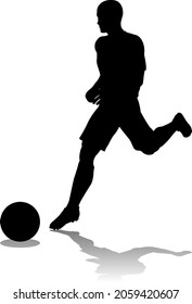 A soccer or football player in silhouette 