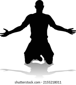 A soccer or football player in silhouette 