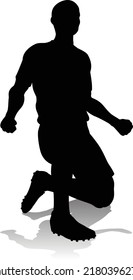 A soccer or football player in silhouette 