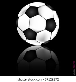 soccer football with reflection on a black background